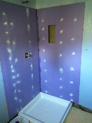 NEW PURPLE SHEETROCK PROVIDED BY HOME DEPOT AND NEW FLORESTONE SHOWER PAN PROVIDED BY WHCI SUPPLY A-1 INSTALLED.