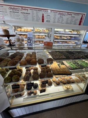 Display case showing muffins and part of the menu