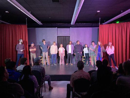 Students performing an improv comedy show