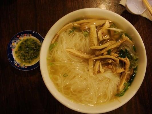 Pho ga with thin rice noodles. Ginger/green onion/salt and oil dipping sauce on the left.