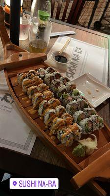 Salmon and avocado roll, california roll and two spicy tuna rolls.