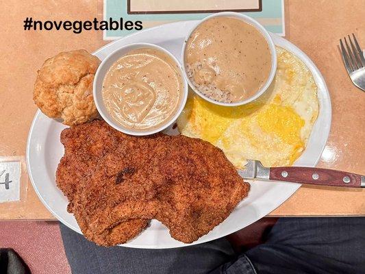 Chicken-fried, bone-in pork chops, three eggs over hard, rice with gravy, more gravy and a perfect biscuit. No room for vegetables!