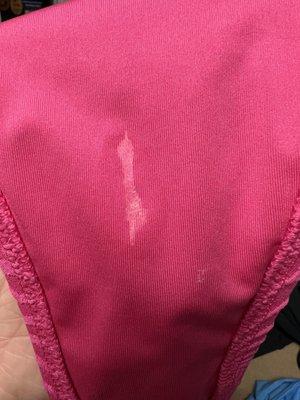 Residue on a used bathing suit bottom being sold as brand new