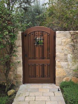 Old World Style Gate with Speakeasy Grill and Decorative Clavos by Garden Passages