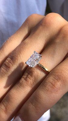 radiant engagement ring  with a hidden halo style