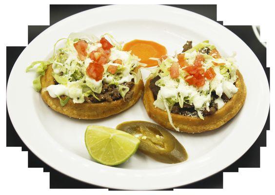 SOPES 
MADE SOPE WITH CORN MASA FRIED AND TOPPED WITH CARNE ASADA LETTUCE TOMATO SOUR CREAM AND COTIJA CHESSE.