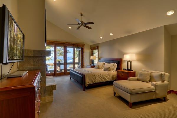 The master bedroom (4-bedroom unit) has a king bed, gas fireplace, private wet bar and big screen television.