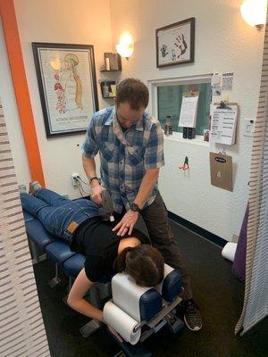 Dr. Milam working on my friend's back doing a deep tissue massage