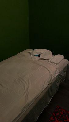 Bed in one of the private full body massage rooms.