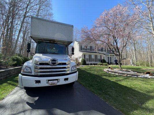 Moving truck in front of a house