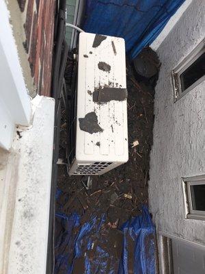 AC condenser with debris on it and roofing debris directly below it because the contractors threw debris directly at our AC condenser.