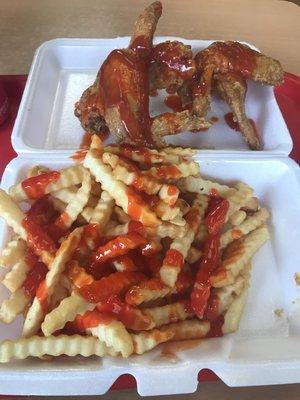 Chicken wigs hot sauce ketchup. French fries honey bbq sauce