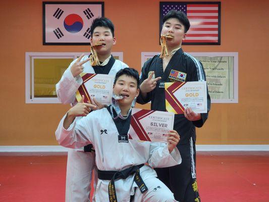 The Yi brothers and their 2 gold + 1 silver medal!