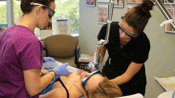 Kate Dellangelo, APRN, performing a laser skin resurfacing treatment