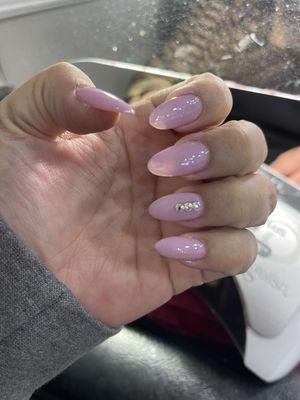 Soft pink almond shaped nails.