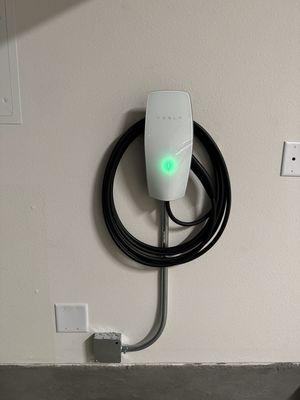 A new Tesla Wall Connector EV charger installation in Riverside, California.