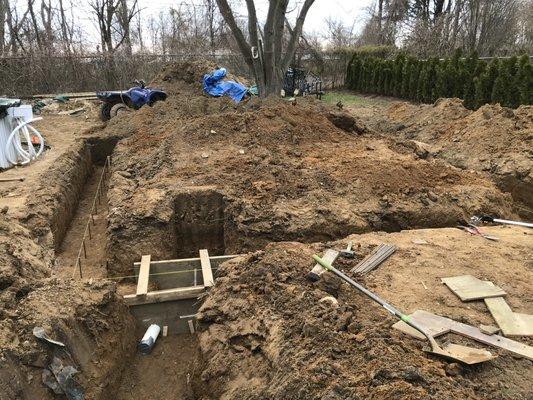 Trenching for electric, sewer, gas and water for new 2 car garage