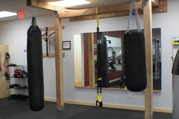 Hit a heavybag or two or three at Wolf Total Fitness