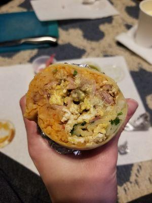 Steak and ham breakfast burrito (rice, beans, cheese, salsa, cilantro and onions)