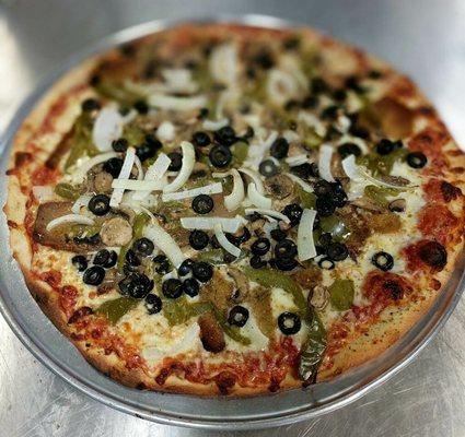 Letizia's Veggie Pie topped with our homemade breaded eggplant, garlic, olives, mushrooms, homemade roasted peppers, and onions