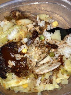 Jerk chicken meal with white rice and steamed cabbage