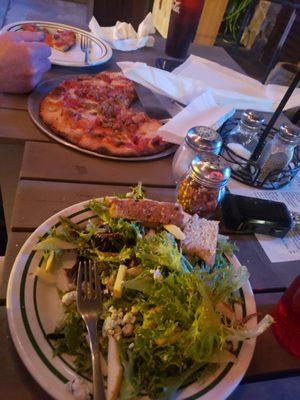 Apple gorgonzola salad and meat pizza.