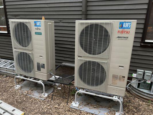 The two outside heat pumps