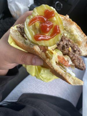 Avocado Bacon Burger The burgers are big. can barely hold with one hand. pickles are big too