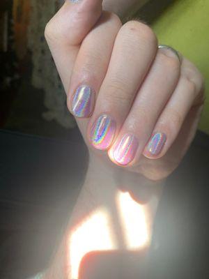 Gel manicure with holographic powder add on! So far it's lasted over 2 weeks with tons of dishwashing and packing to move.