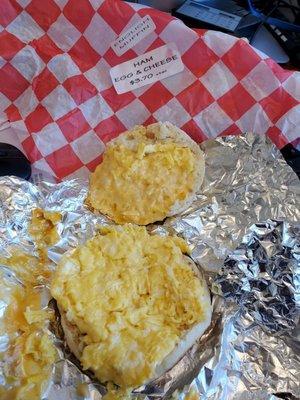 Ham egg and cheese breakfast sandwiches with no ham and only pieces of egg like they shaped it off the bottom of the pan.