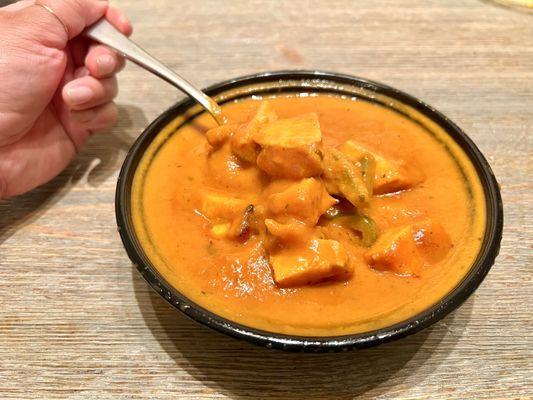 Chicken Tikka Masala. Chicken is slightly firm, but still very good. The masala sauce has a sweet and earthy flavor with layers of spicing.