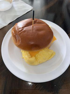 Egg & cheese sandwich on brioche bun