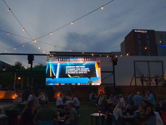 check out this big screen outside !.wow