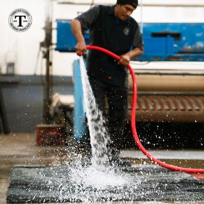 While cleaning, the rug undergoes a meticulous dusting before being hand-washed, fully immersed in water.