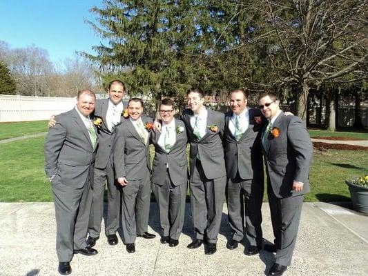 The groomsmen pose outside on the beautiful grounds on this sunny April afternoon!