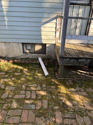 First "before" photo of old, damaged back porch.