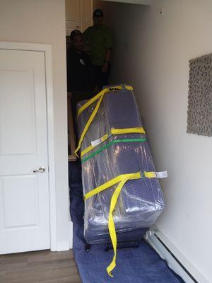 One piano coming safely down the stairs.