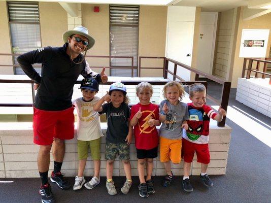 Gene and five future Grand Slam champs after a junior group lesson at the club!