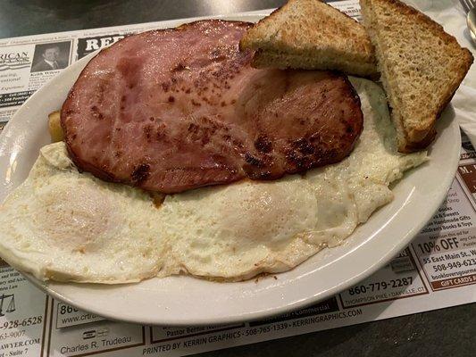 My husbands eggs, home fries (under the ham), ham and toast