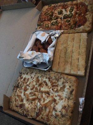 Big Dinner Box, spicy garlic Bone-Out Wings, 5 Classic Breadsticks, Buffalo Chicken Pizza, Alfredo pizza