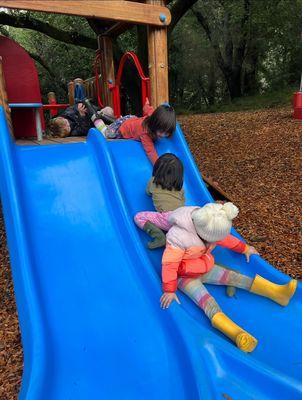 Sequoia Nursery School Kids playing on the slide.