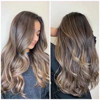 Beige blonde balayage with long layer haircut.