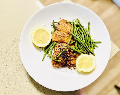 Salmon w/  Frozen Haricot Verts accompanied by fresh lemon squeeze. All ingredients from the local Trader's Joe