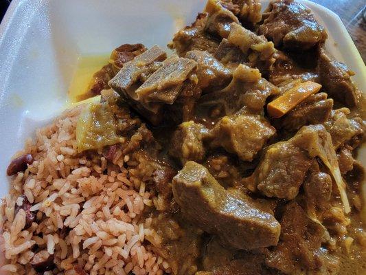 Curry goat, peas and rice