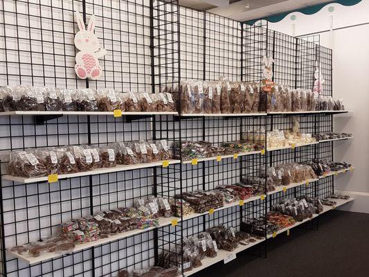 Back wall has novelty chocolates,  homemade malted milk chocolate balls, raspberries  & blackberries,  cappuccino coffee beans...