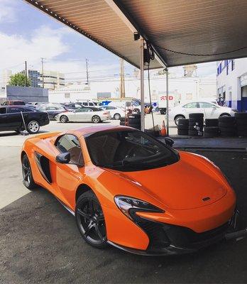 New Mclaren after a quick wash waiting for an Alignment. We do wheel alignments for all types of exotic cars in our neighborhood.