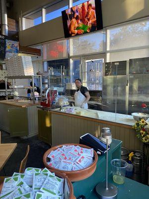 You can watch the chefs prepare the pizzas