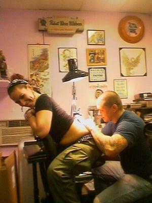 Dave from R&D expanding Lady Zombie's lower back tattoo.