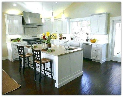 Beautiful contrast with white cabinets and dark flooring.