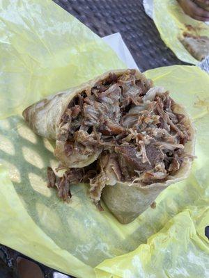 Chile Verde dripping goodness all over the hand made flour tortilla..